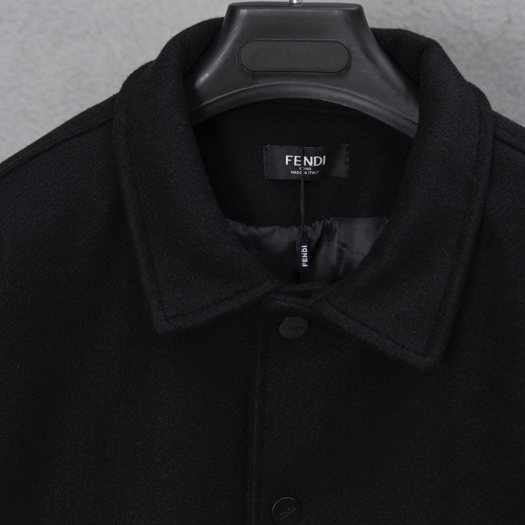 Black long jacket neckline with interior logo label and button placket