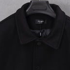 Black long jacket neckline with interior logo label and button placket