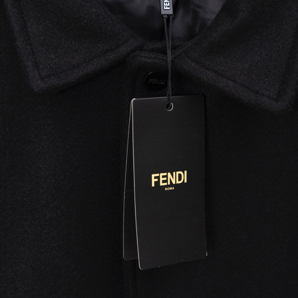 FENDI hang tag on black fabric with FENDI logo and white text
