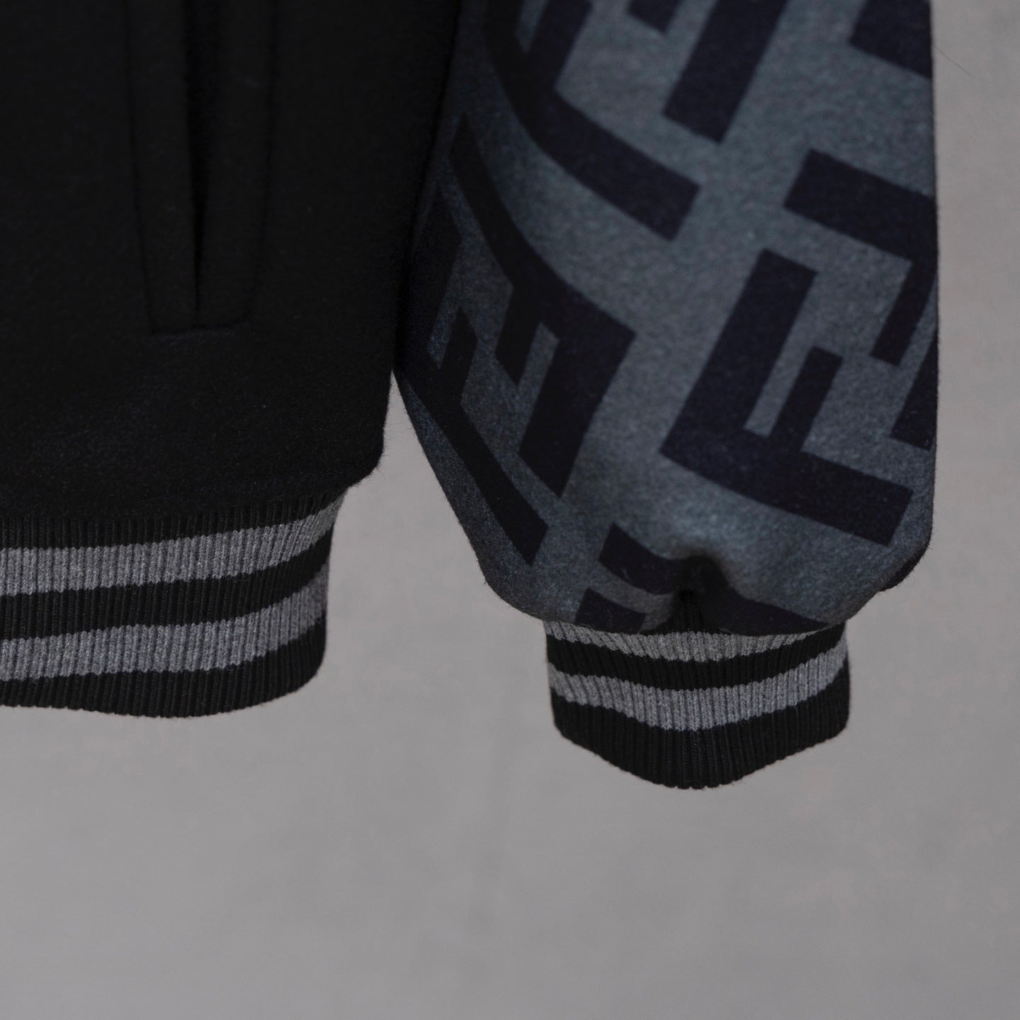 Black long jacket sleeve cuff with striped ribbing and FF logo panel