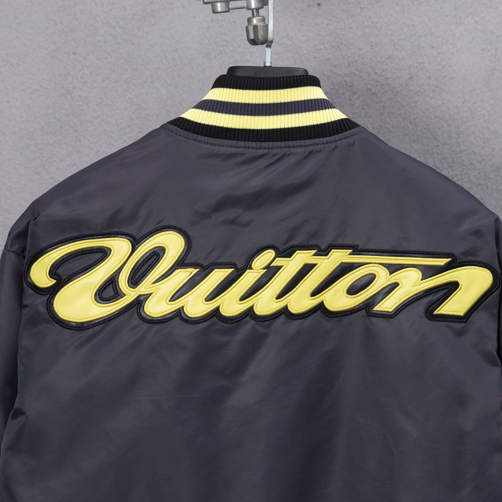 Louis Vuitton long bomber jacket back with yellow “Quittton” style script logo