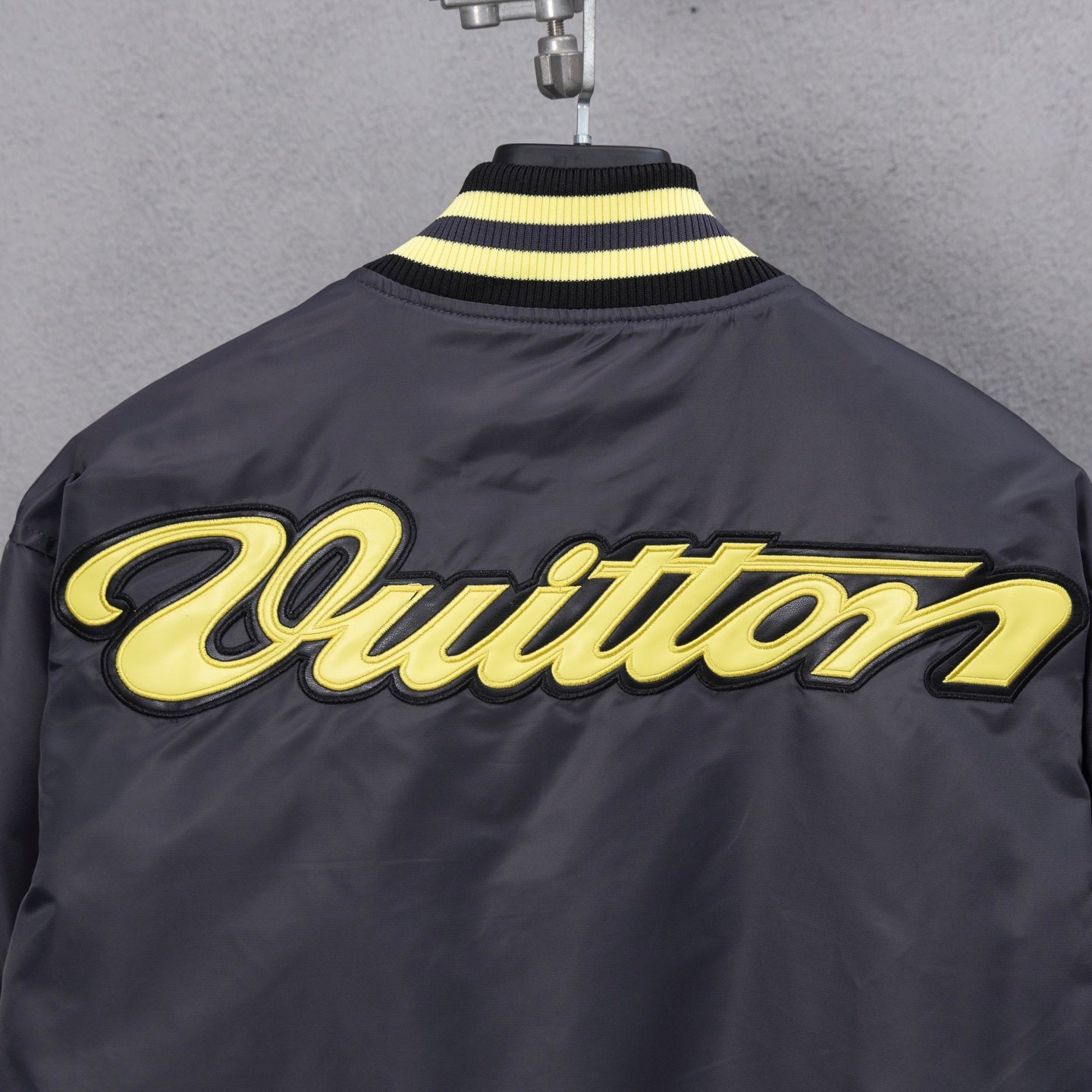 Louis Vuitton long bomber jacket back with yellow “Quittton” style script logo