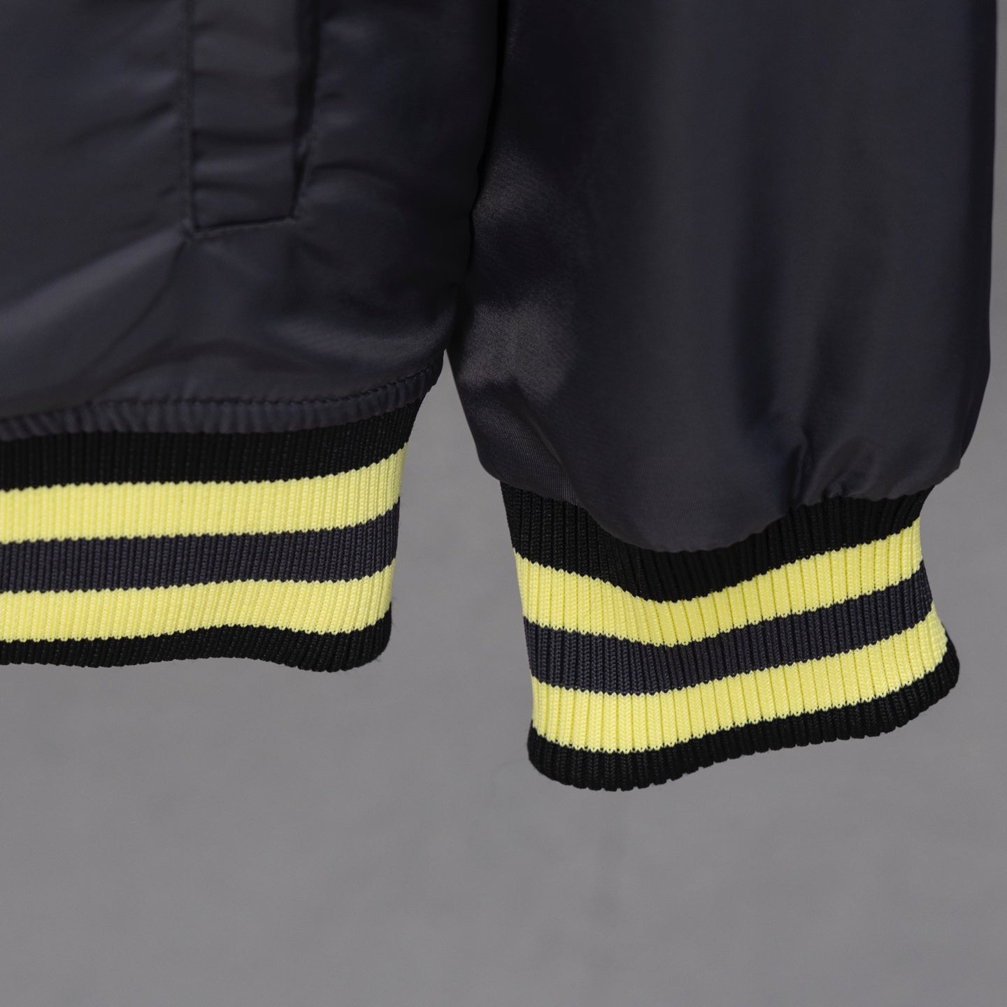Louis Vuitton long bomber jacket hem and lower sleeves with yellow ribbed stripes