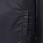 Louis Vuitton long bomber jacket front seam detail with dark snapped panel