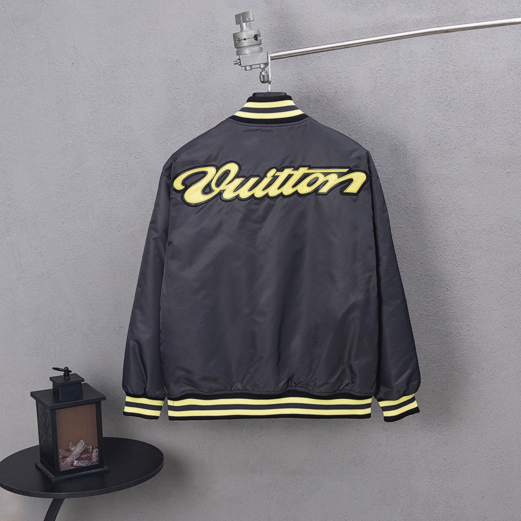 Louis Vuitton long bomber jacket, back view, yellow script logo and striped hem
