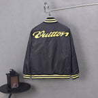 Louis Vuitton long bomber jacket, back view, yellow script logo and striped hem