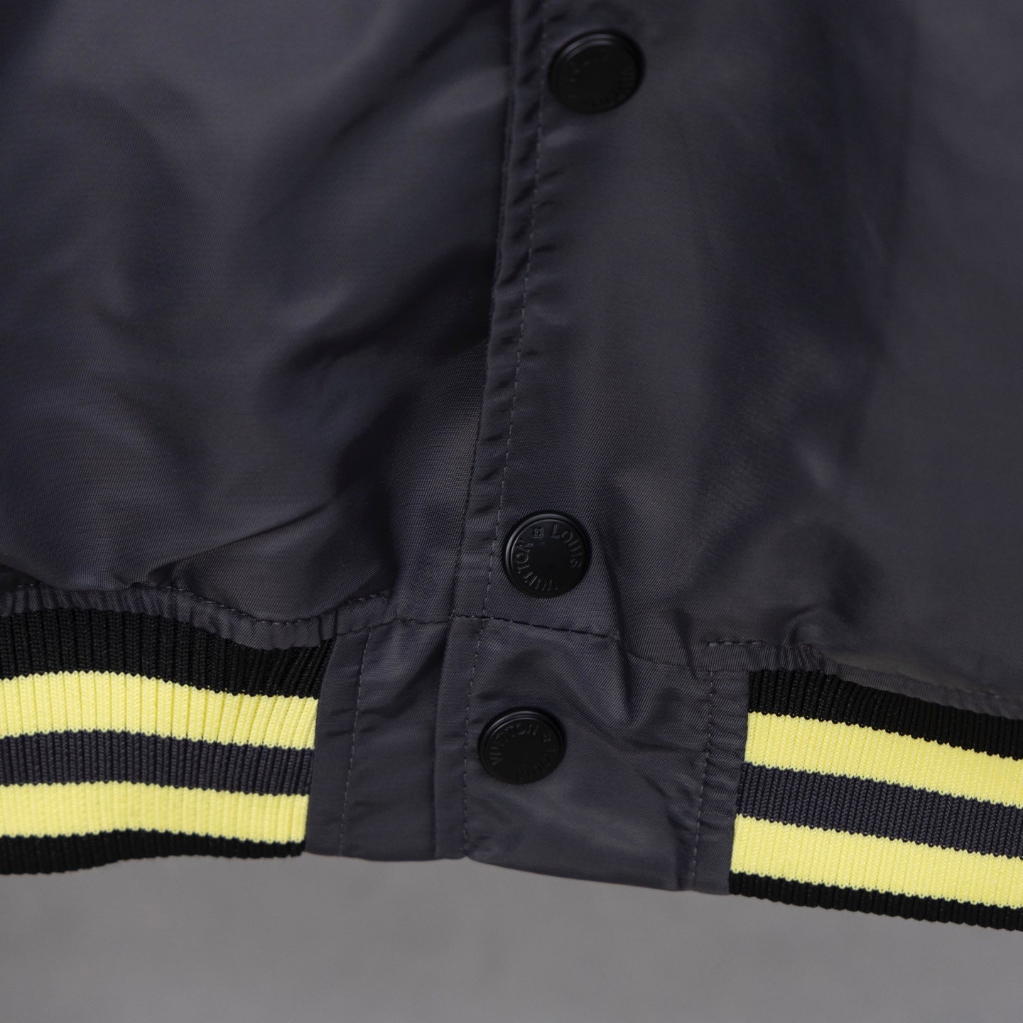 Louis Vuitton long bomber jacket cuff with dark snap buttons and yellow stripe
