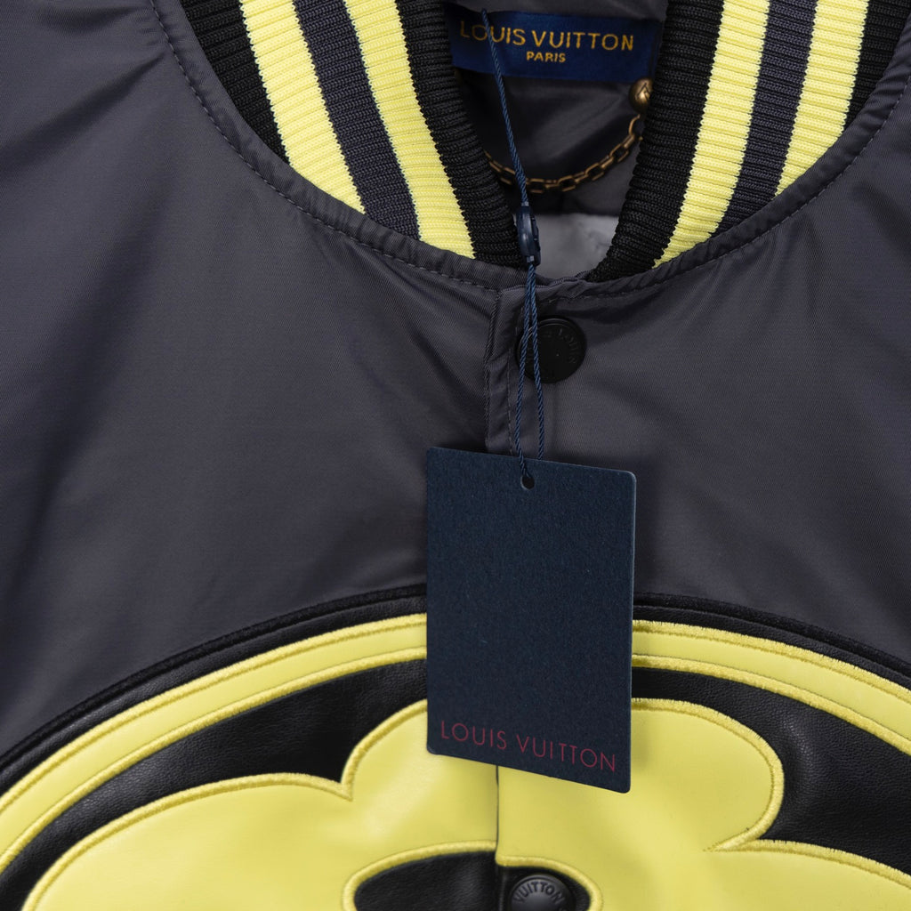 Louis Vuitton long bomber jacket neck detail with dark collar stripe and logo tag