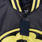 Louis Vuitton long bomber jacket neck detail with dark collar stripe and logo tag