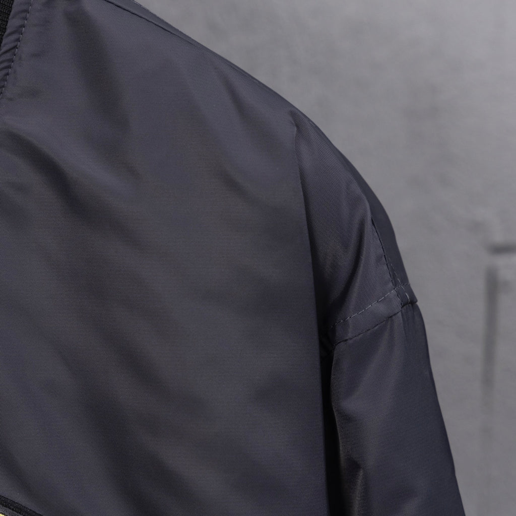 Louis Vuitton long bomber jacket sleeve with smooth dark fabric and stitching