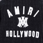 Pinstripe varsity jacket back graphic with 'AMIRI' and 'HOLLYWOOD' text