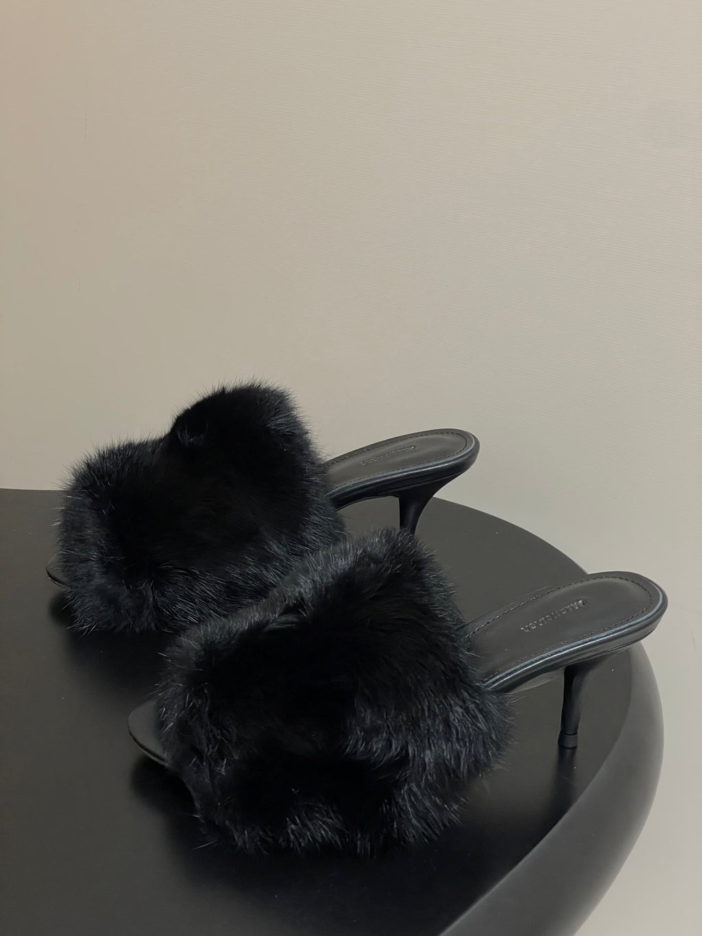 Black fur slide sandals with open toe and slim heel