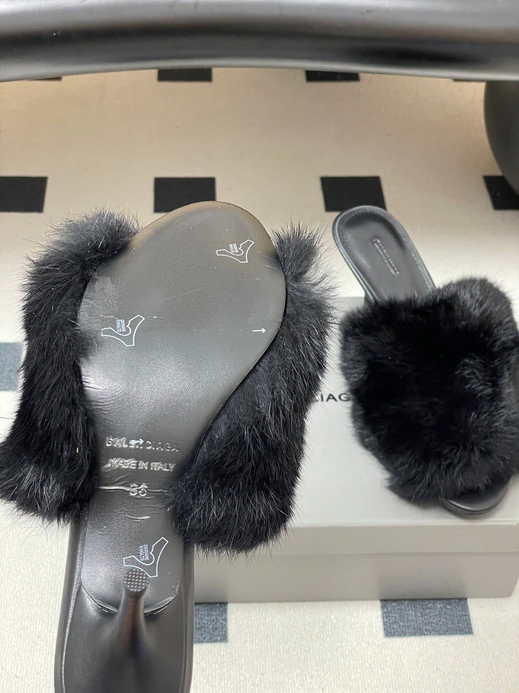 Black fur slide sandals with covered footbed and flat base