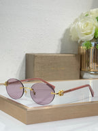 Rose gold sunglasses with light pink lenses and rose temples, round lenses, jeweled accent.
