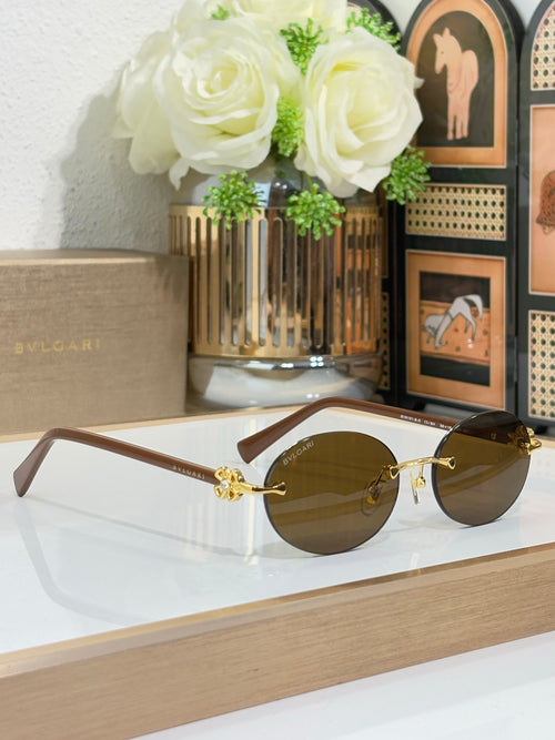 Bvlgari cat-eye glasses with light brown temples, gold accents, olive-tinted lenses
