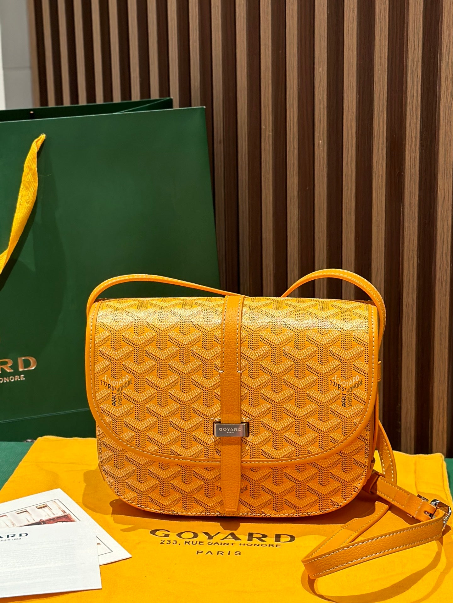 Goyard yellow patterned crossbody bag with top handle and gold-tone clasp