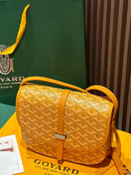 Goyard yellow patterned crossbody bag with adjustable shoulder strap and clasp