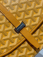 Goyard yellow jacquard monogram pouch with black logo patch and leather trim