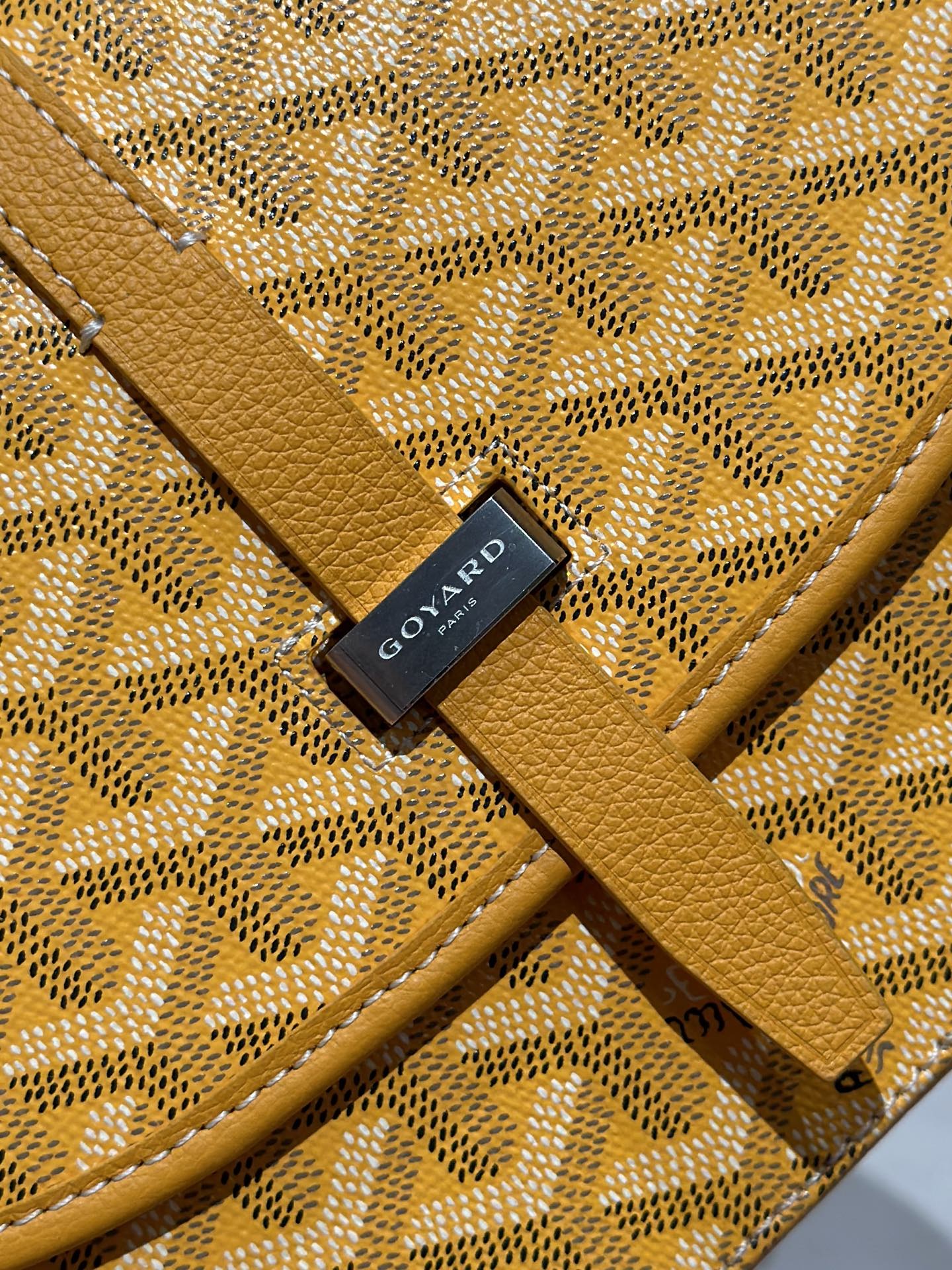Goyard yellow jacquard monogram pouch with black logo patch and leather trim