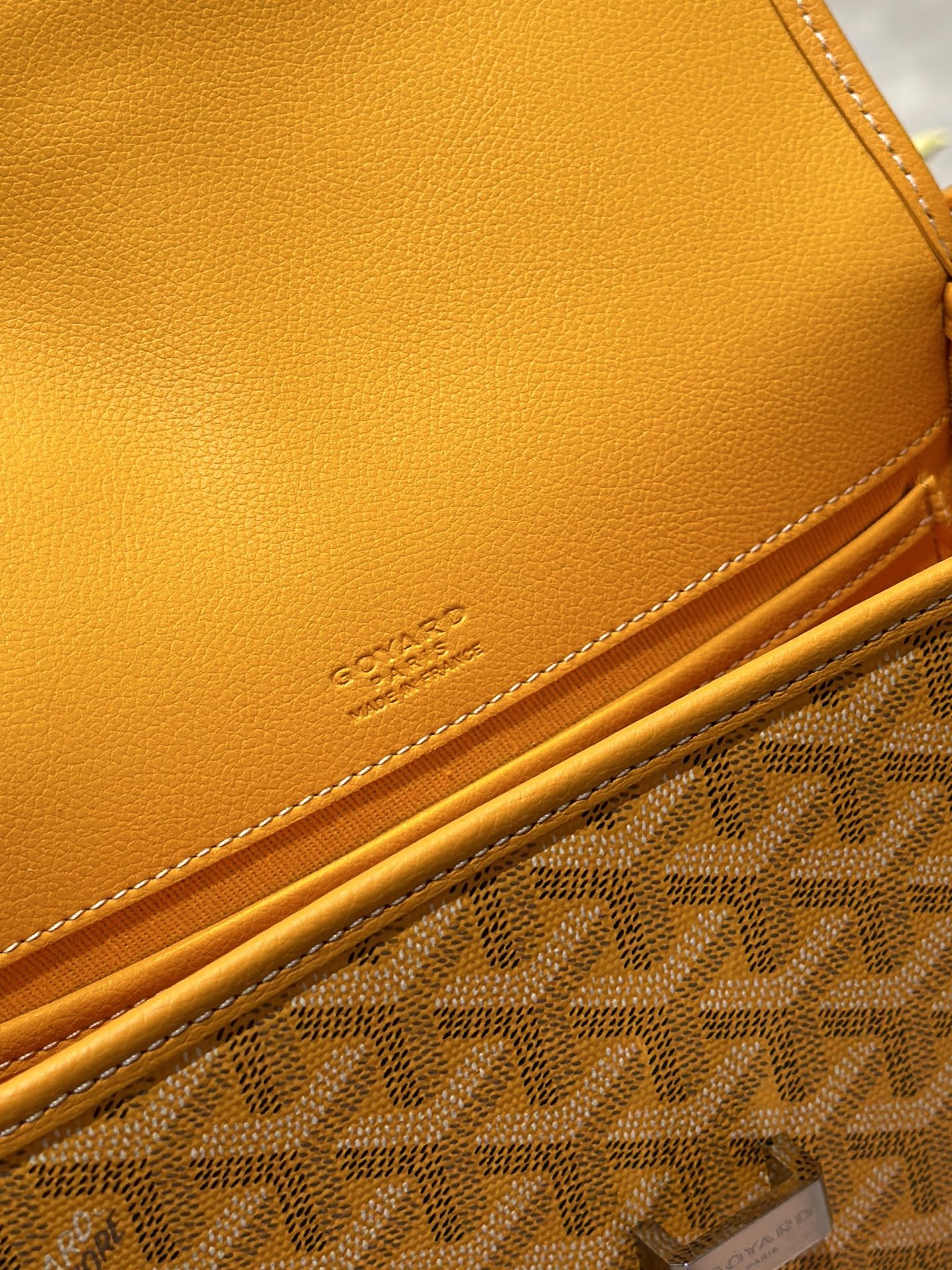 Goyard yellow leather edge with embossed logo and monogram canvas border