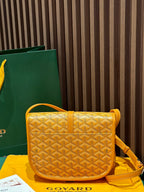 Goyard yellow patterned crossbody bag with shoulder strap and front flap