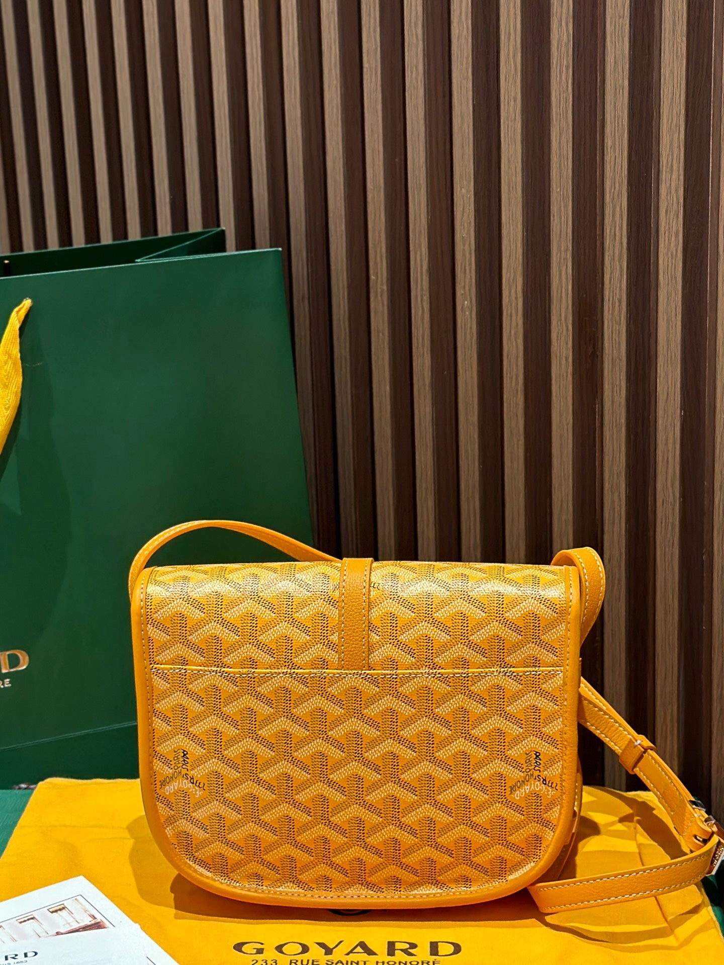 Goyard yellow patterned crossbody bag with shoulder strap and front flap