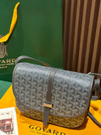 Goyard crossbody bag, monogram-style pattern with front flap and shoulder strap