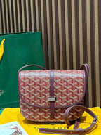Goyard crossbody bag with maroon leather trim and red patterned Goyardine flap
