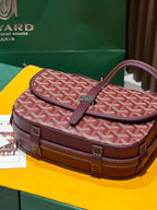 Goyard messenger bag with red monogram canvas, maroon flap and front buckle detail