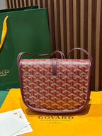 Goyard crossbody bag with red monogram canvas, maroon straps and front flap
