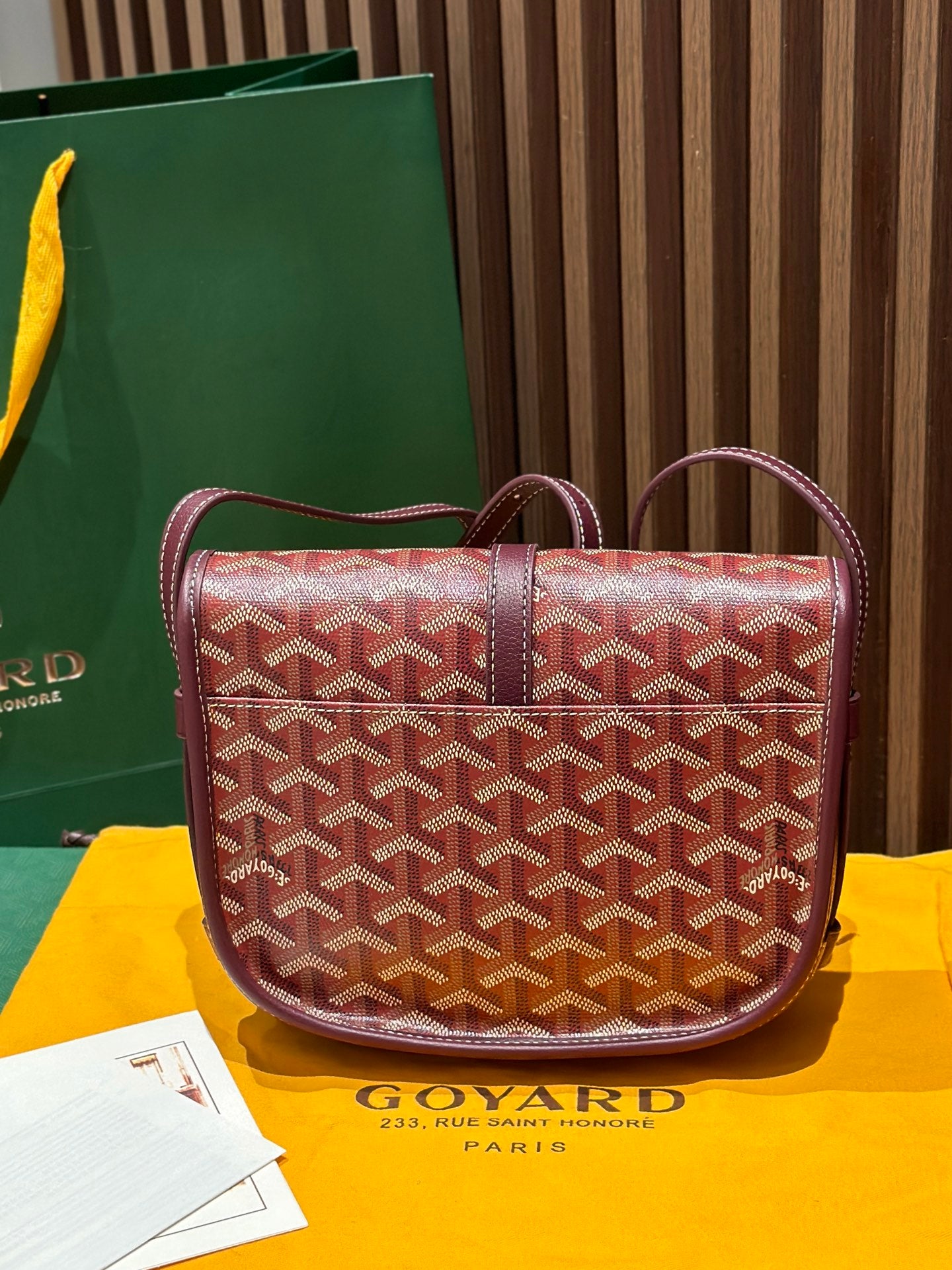 Goyard crossbody bag with red monogram canvas, maroon straps and front flap