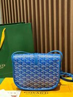 Goyard bag crossbody in blue with monogram pattern and top flap over strap
