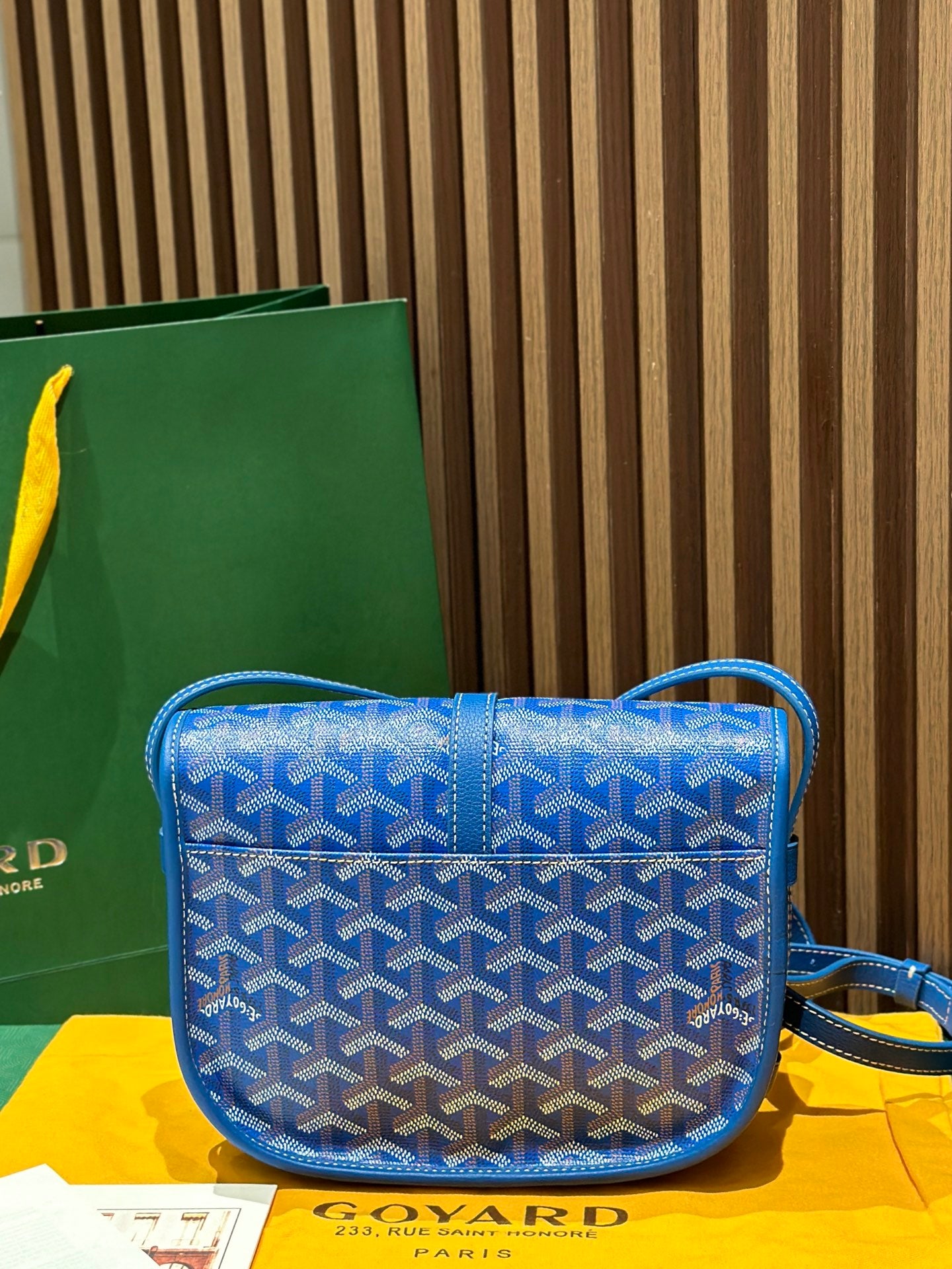 Goyard bag crossbody in blue with monogram pattern and top flap over strap