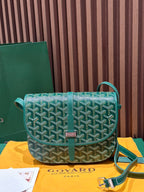 Goyard green patterned crossbody bag with flap, gold clasp, and adjustable strap