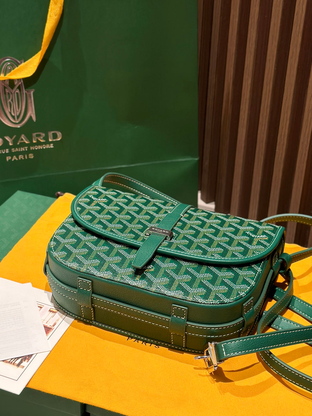 Goyard green patterned crossbody bag with flap and stitched side details