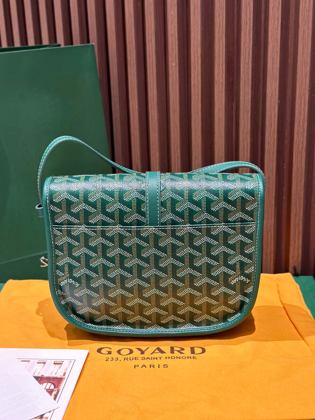 Goyard green patterned crossbody bag with flap and adjustable shoulder strap
