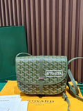 Goyardine crossbody bag in green with geometric pattern, flap, and adjustable shoulder strap.