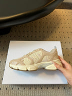 Dior unisex sneaker outsole view, cream platform sole with patterned tread