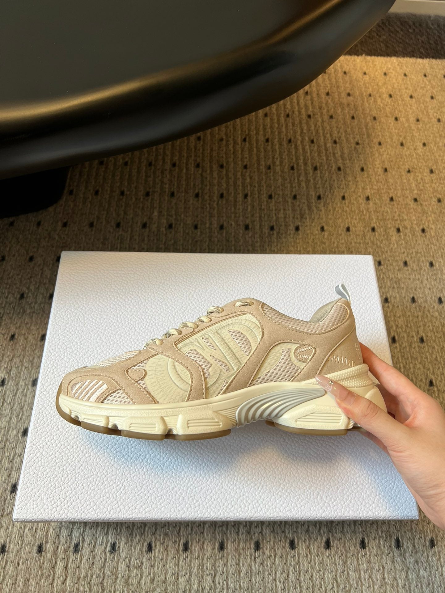 Dior unisex sneaker outsole view, cream platform sole with patterned tread