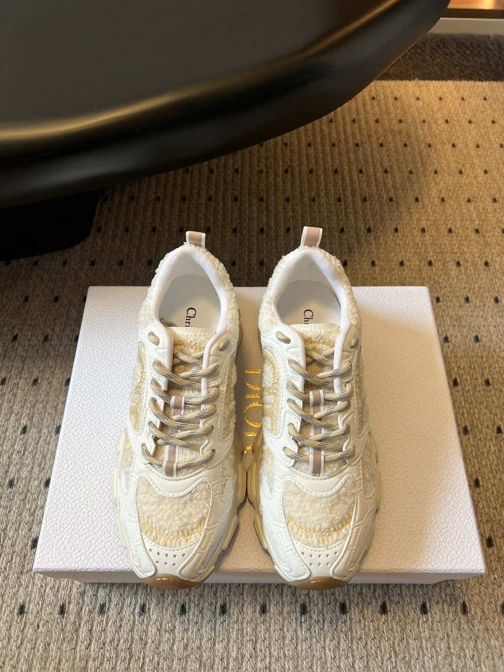 Dior unisex sneakers in white with gold accents, lace-up with textured panels
