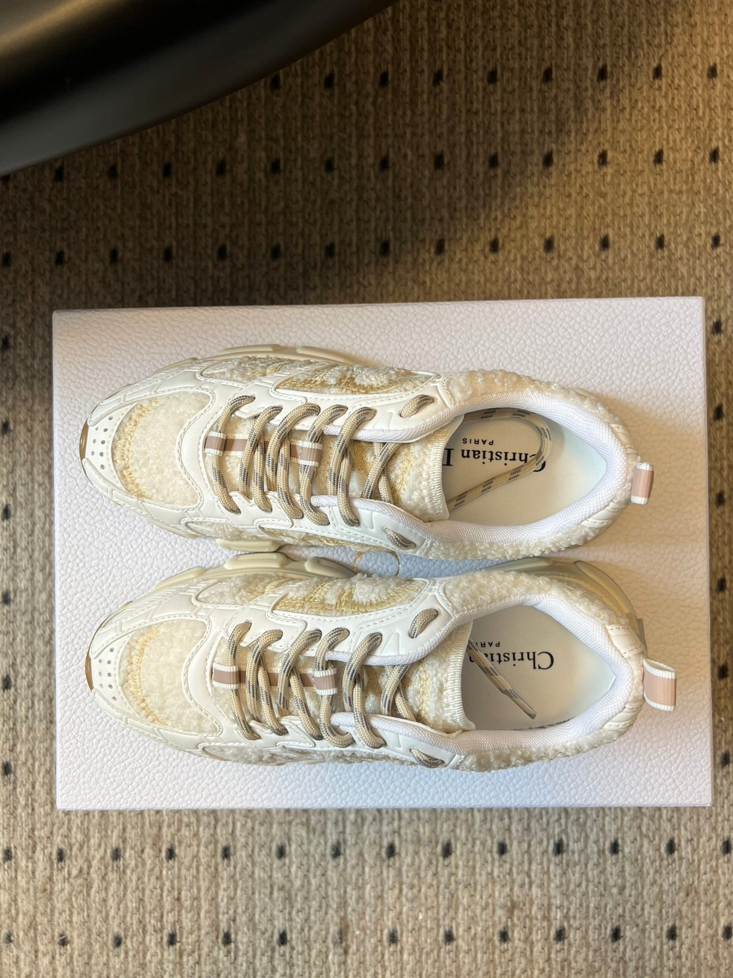 Dior unisex sneakers, white with gold speckled pattern, lace-up top view