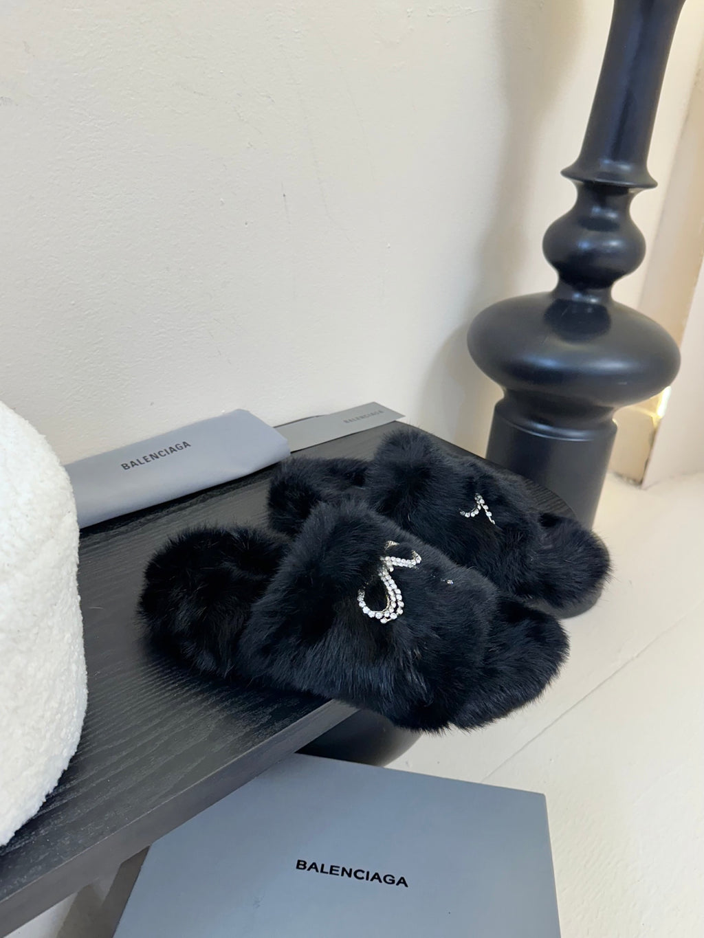 Balenciaga black fur slide sandals with crystal bow detail on the strap