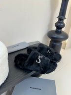 Balenciaga black fur slide sandals with crystal bow detail on the strap