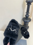 Balenciaga black fur slide sandals with rhinestone bow strap detail