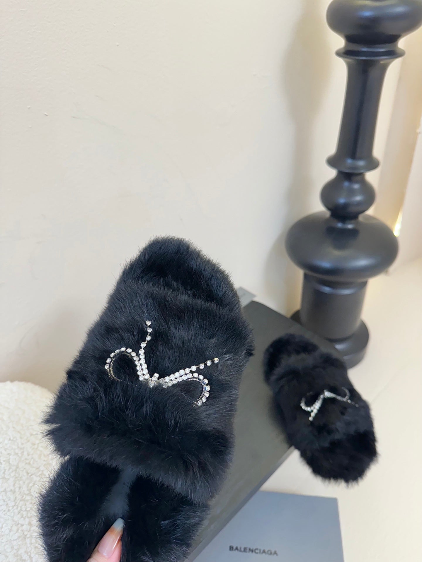 Balenciaga black fur slide sandals with rhinestone bow strap detail