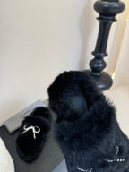Balenciaga black plush slide sandals with rhinestone bow strap and footbed
