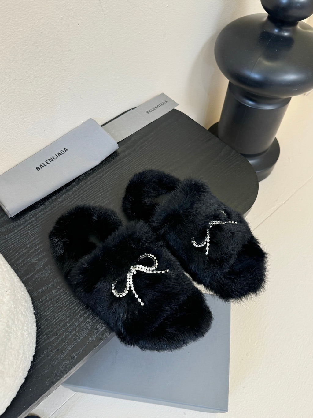 Balenciaga plush black slide sandals with rhinestone bow strap accents