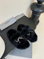 Balenciaga plush black slide sandals with rhinestone bow strap accents