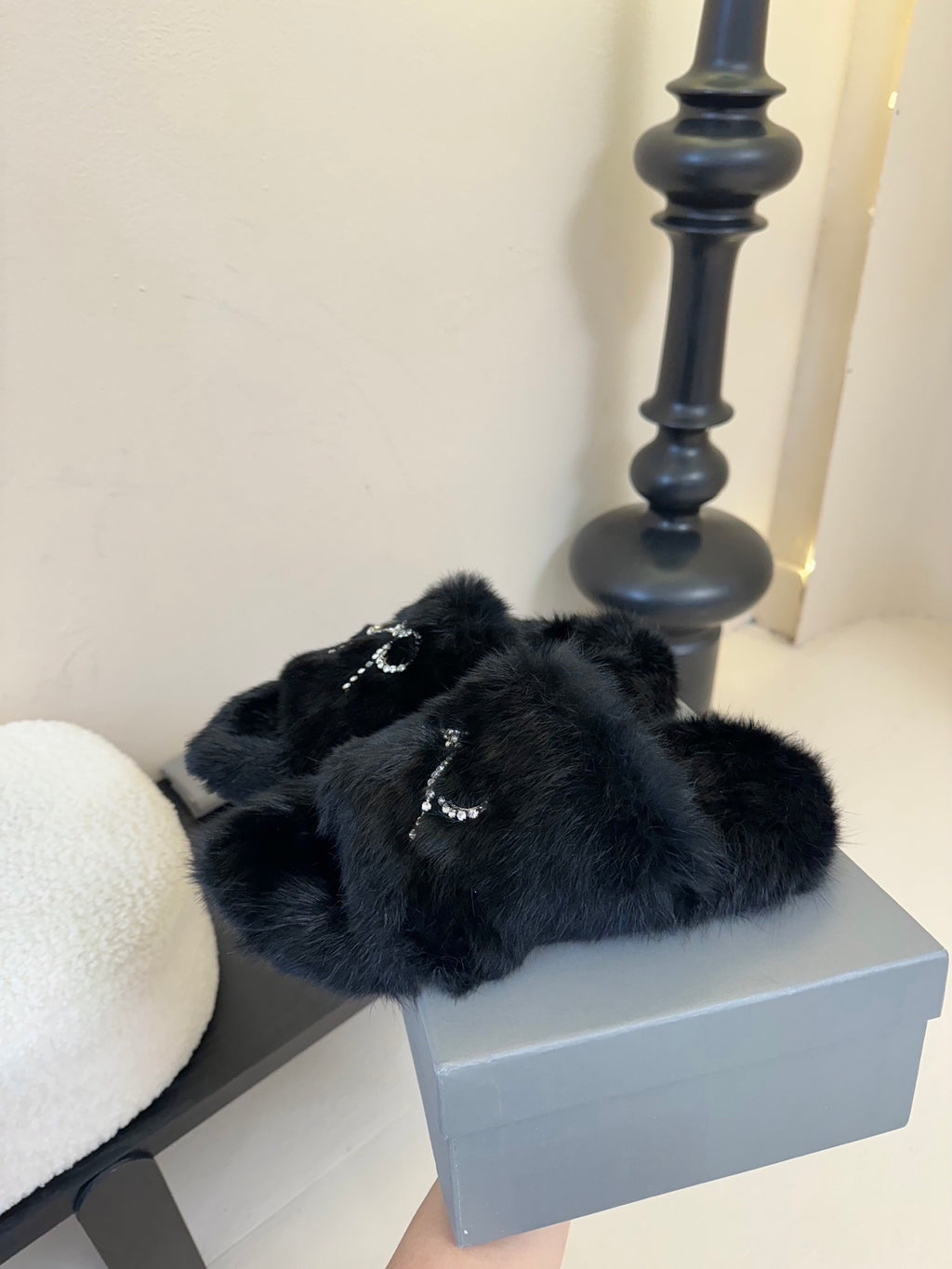 Balenciaga black plush slide sandals with bow-shaped rhinestone strap centerpiece