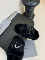 Balenciaga black furry slide sandals with silver-tone bow rhinestone ornament